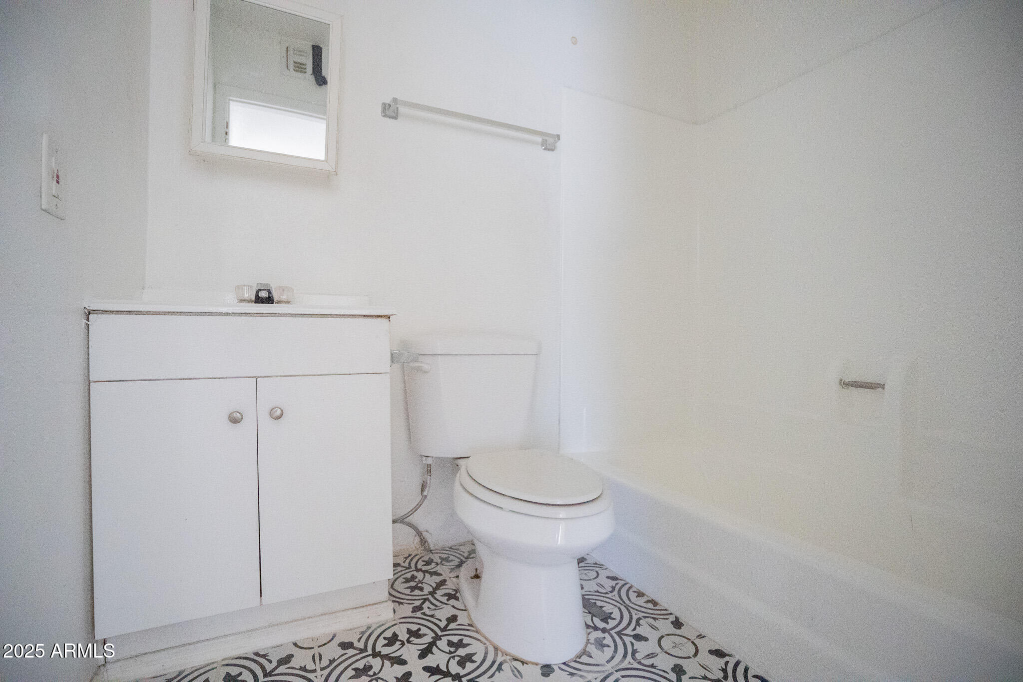 1703 West Mountain View Road, Unit 15 Phoenix, AZ 85021 - Photo 11 of 11 a bathroom with a toilet and a sink