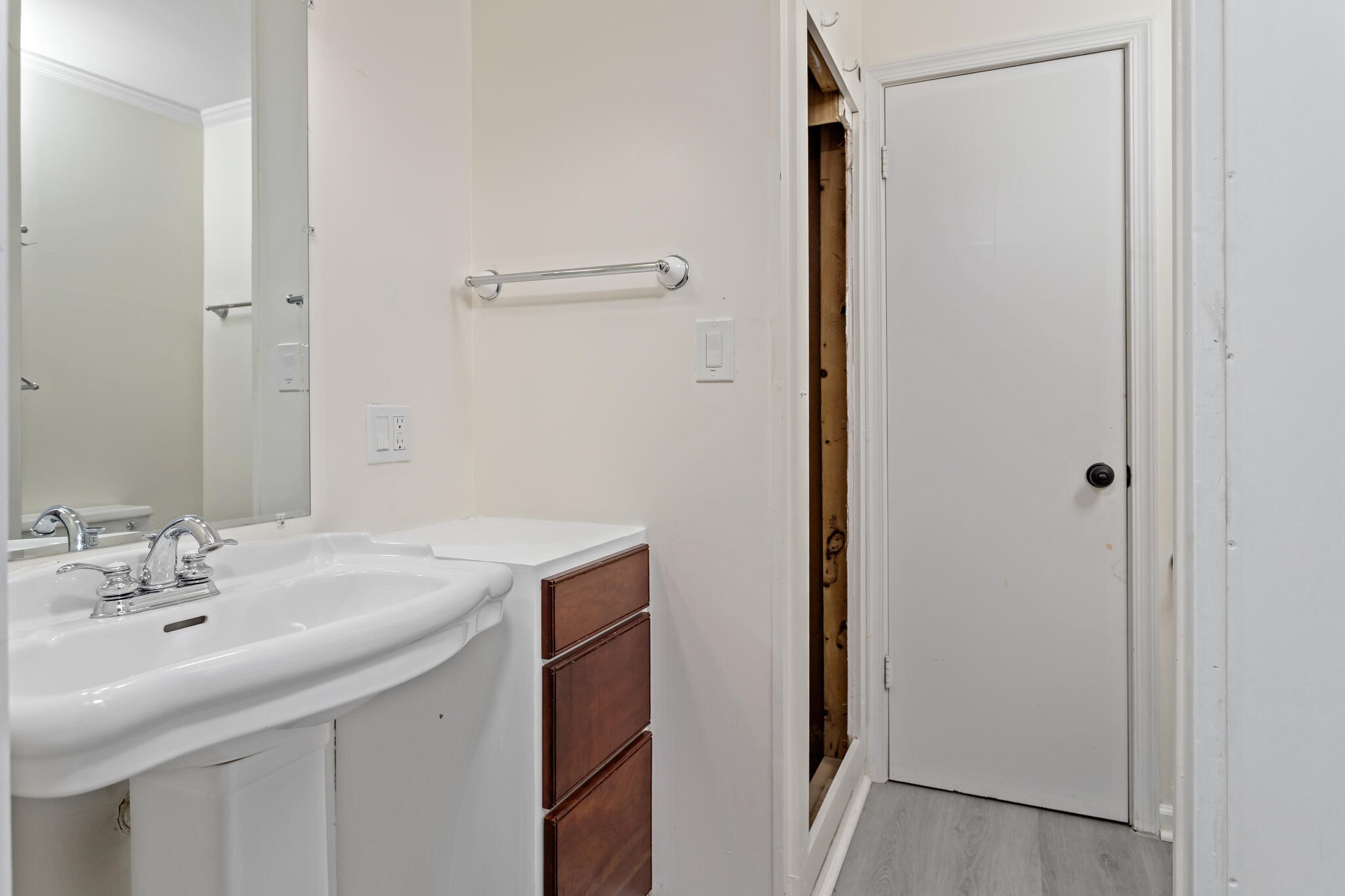 4455 Arthur Street Beaumont, TX 77706 - Photo 12 of 23 a bathroom with a sink and a mirror