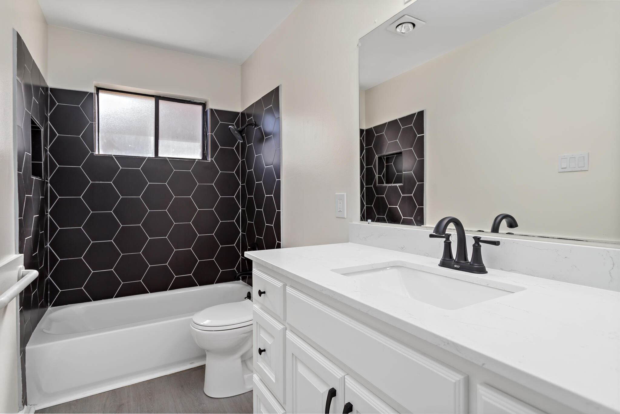 4455 Arthur Street Beaumont, TX 77706 - Photo 16 of 23 a bathroom with a sink a toilet and shower