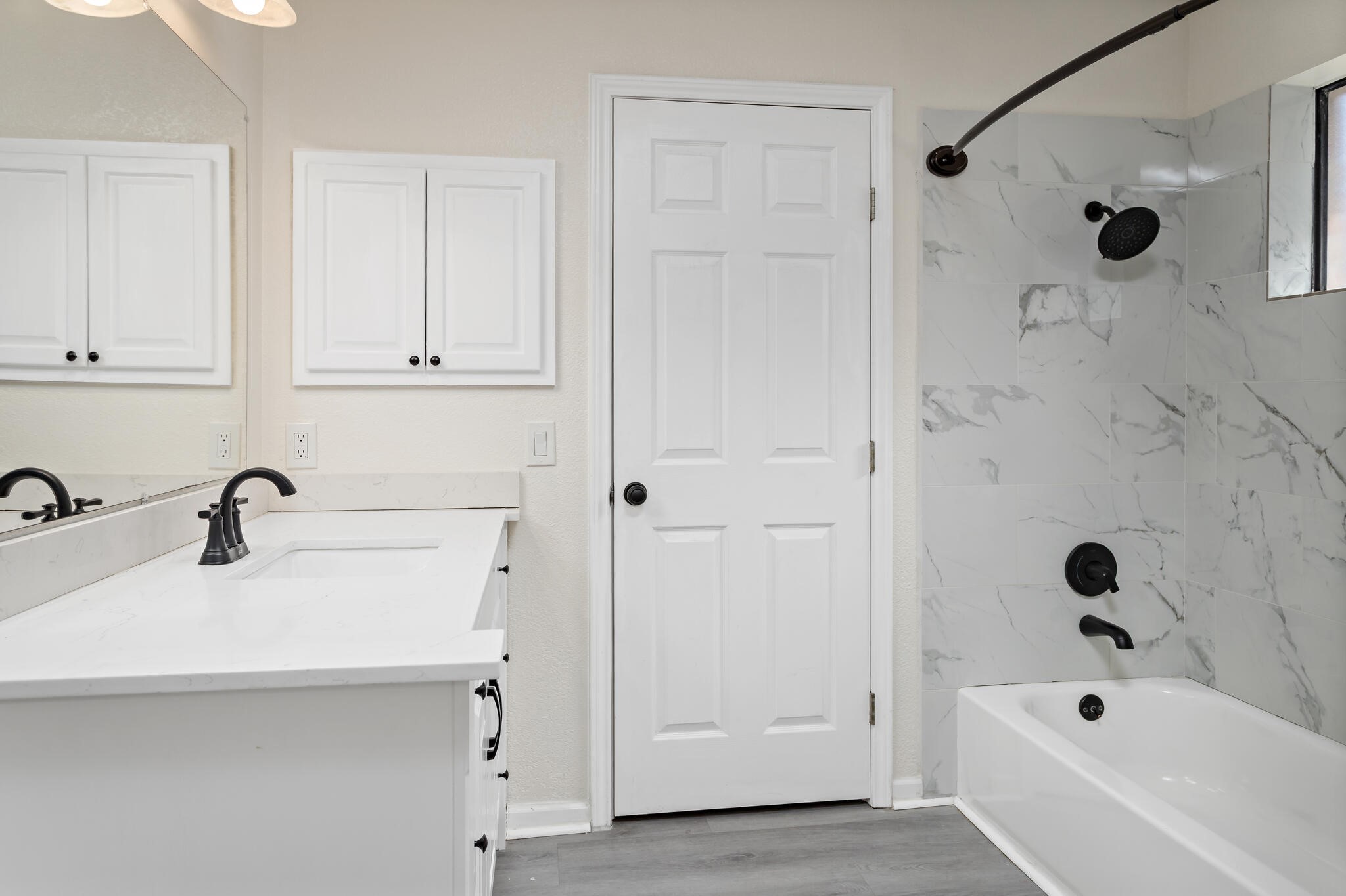 4455 Arthur Street Beaumont, TX 77706 - Photo 20 of 23 a bathroom with a tub a sink and a shower