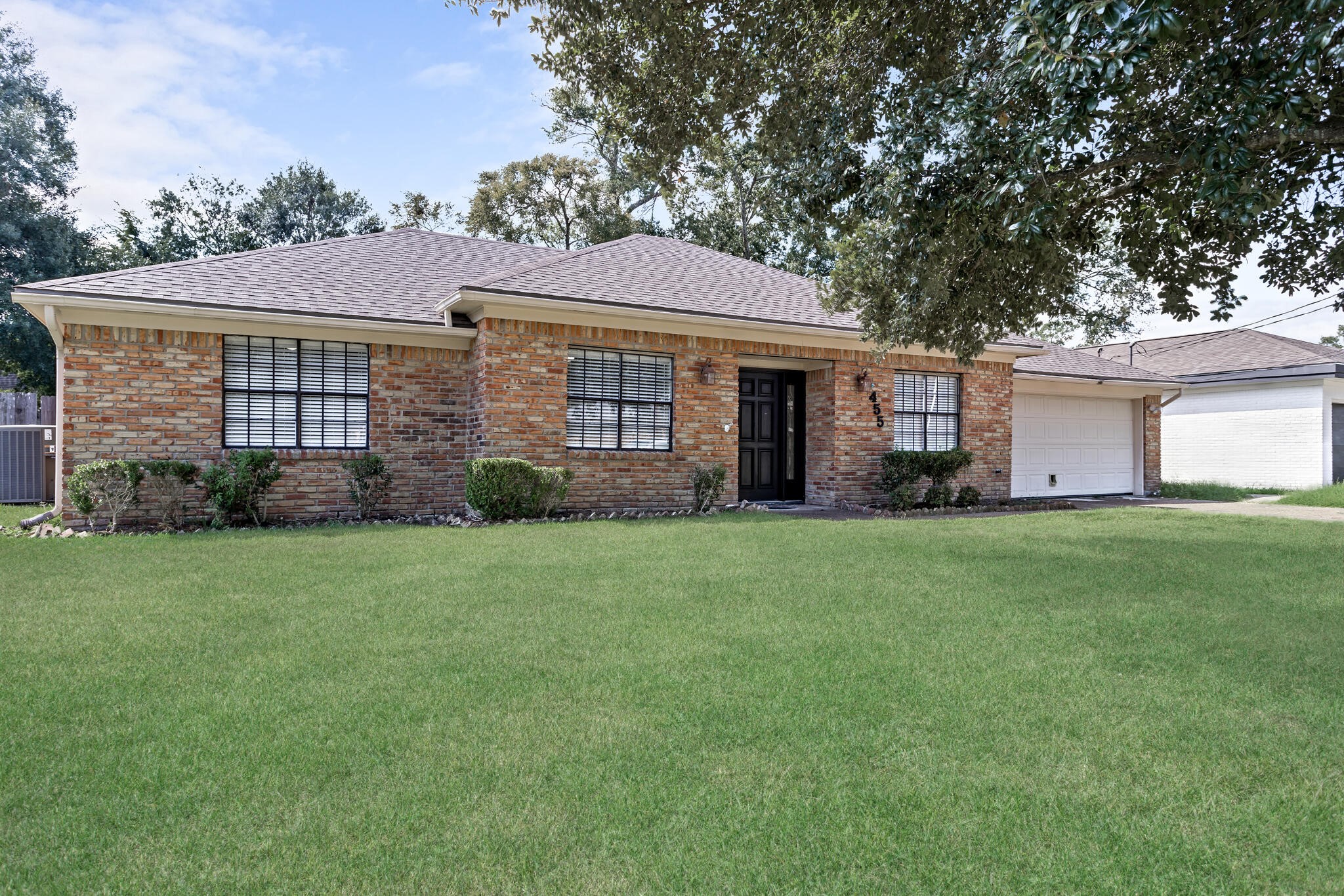4455 Arthur Street Beaumont, TX 77706 - Photo 2 of 23 front view of a house with a garden