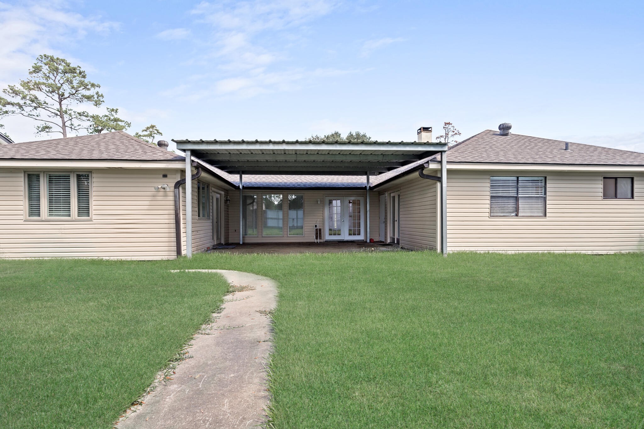 4455 Arthur Street Beaumont, TX 77706 - Photo 21 of 23 a front view of a house with a garden