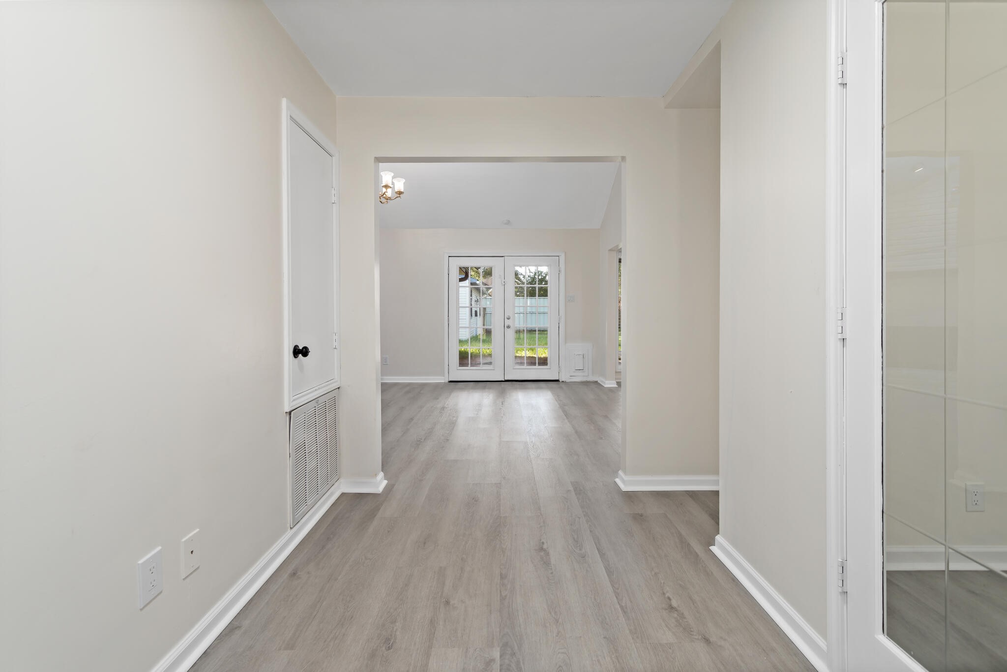 4455 Arthur Street Beaumont, TX 77706 - Photo 3 of 23 a view of a hallway with wooden floor
