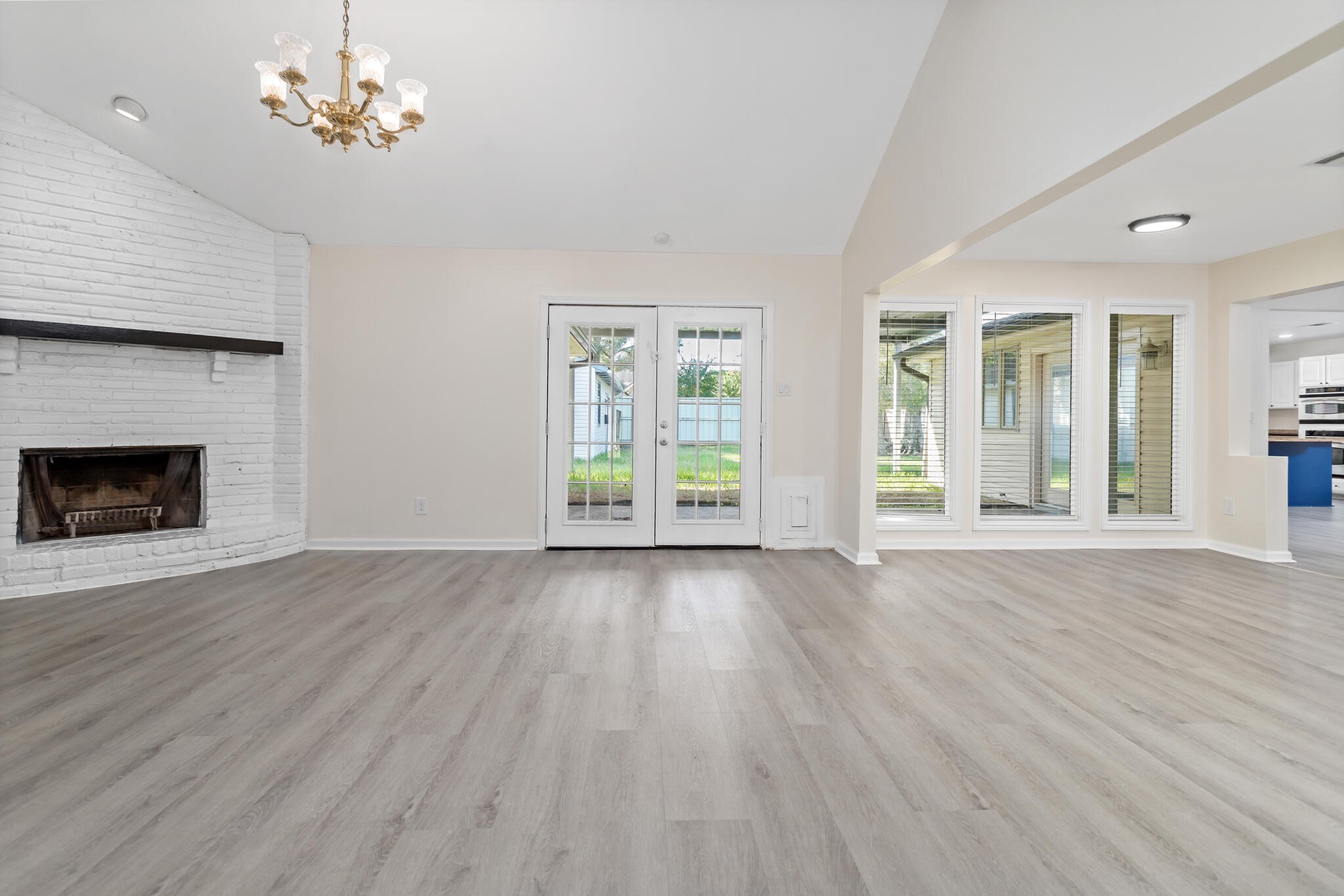 4455 Arthur Street Beaumont, TX 77706 - Photo 5 of 23 a view of an empty room with window and wooden floor