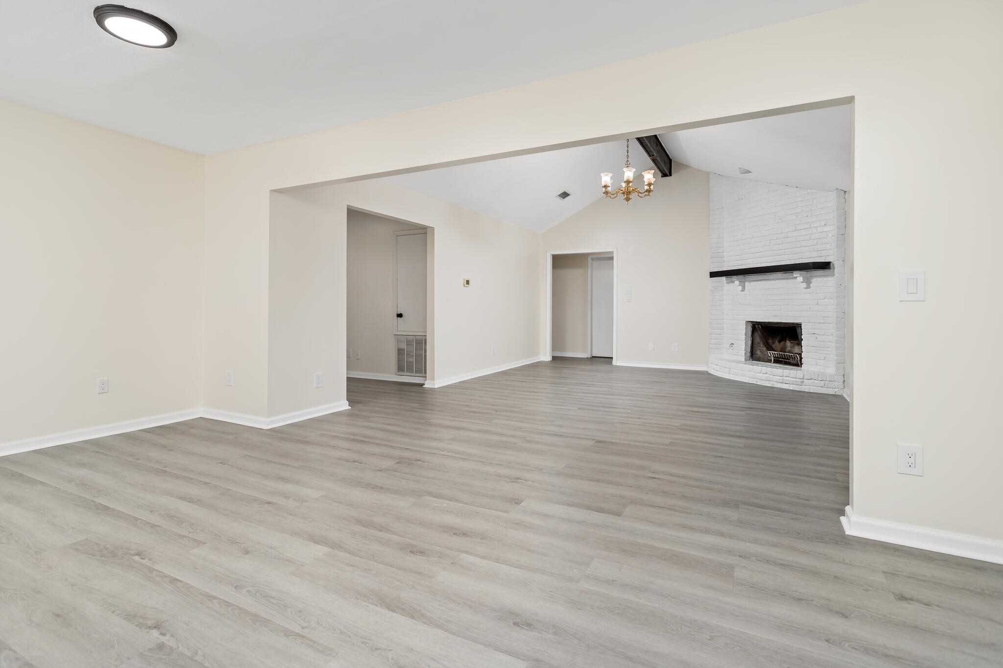 4455 Arthur Street Beaumont, TX 77706 - Photo 8 of 23 an empty room with wooden floor and windows
