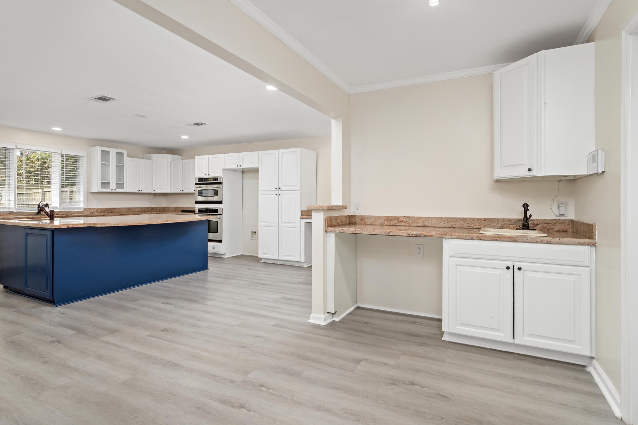 4455 Arthur Street Beaumont, TX 77706 - Photo 9 of 23 a kitchen with stainless steel appliances granite countertop a white cabinets and window