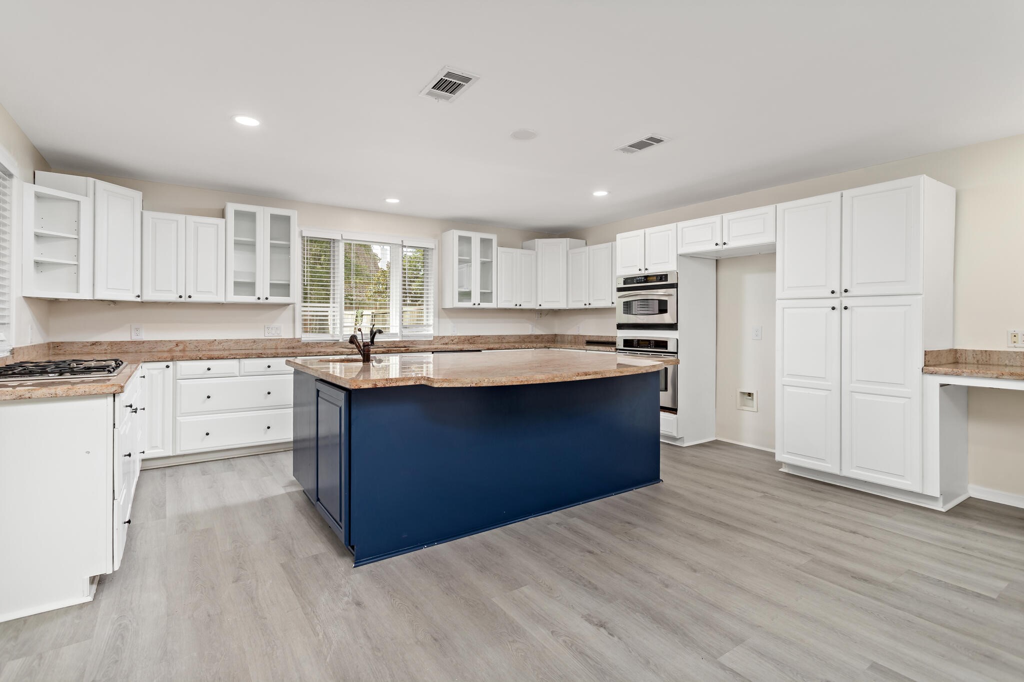 4455 Arthur Street Beaumont, TX 77706 - Photo 10 of 23 a kitchen with granite countertop a sink cabinets stainless steel appliances and a window