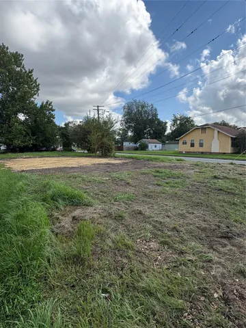 a view of outdoor space with playground and green space