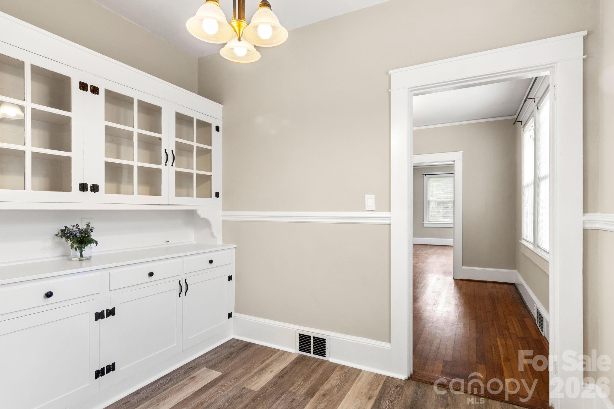 108 Reedy Street Chester, SC 29706 - Photo 10 of 42 a view of a hallway with wooden floor and cabinet