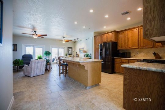 2401 Lacey Street Ridgecrest, CA 93555 - Photo 10 of 44 a view of kitchen with furniture and refrigerator