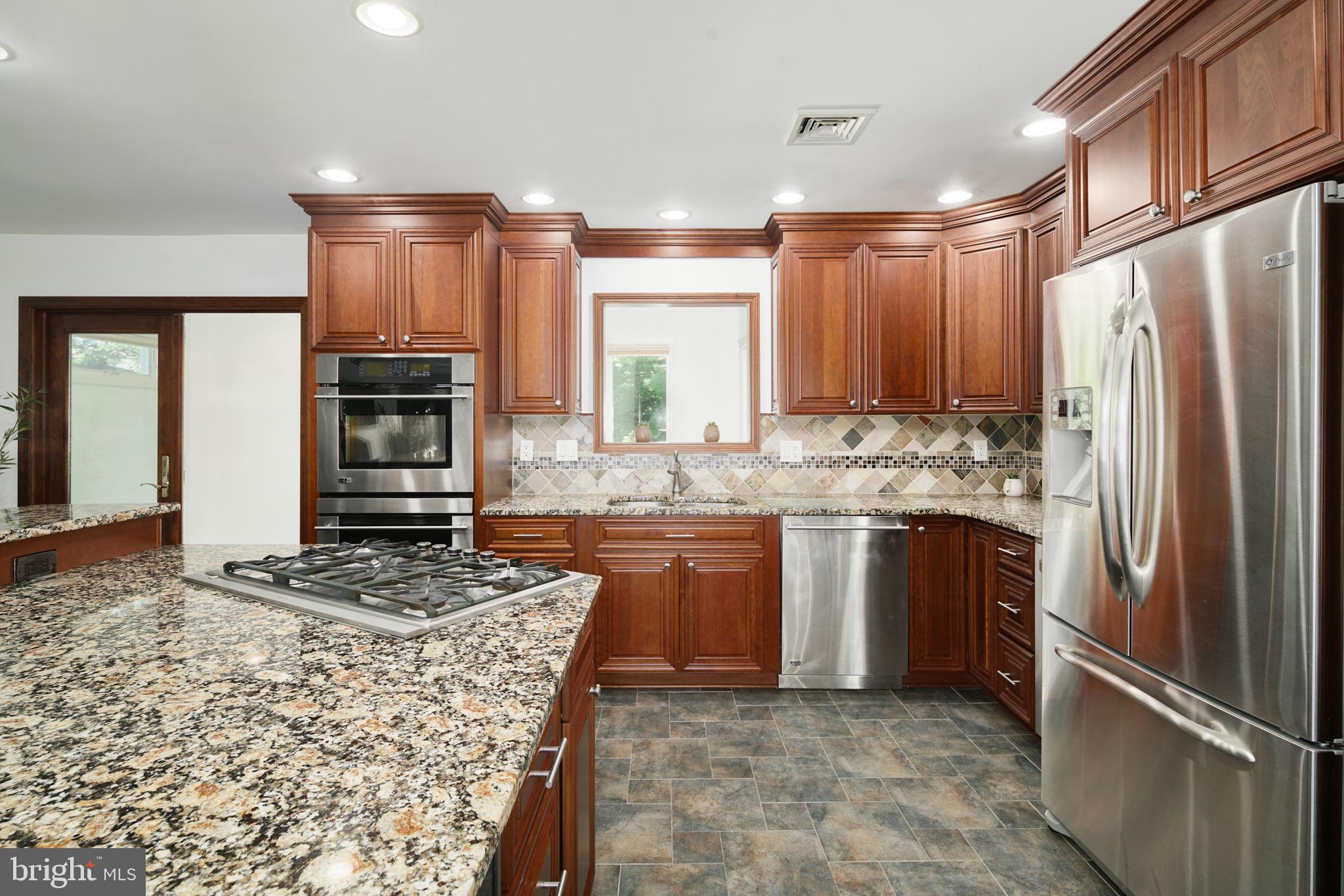 2041 Pennington Road Trenton, NJ 08618 - Photo 11 of 39 a kitchen with stainless steel appliances granite countertop a refrigerator a stove and a sink