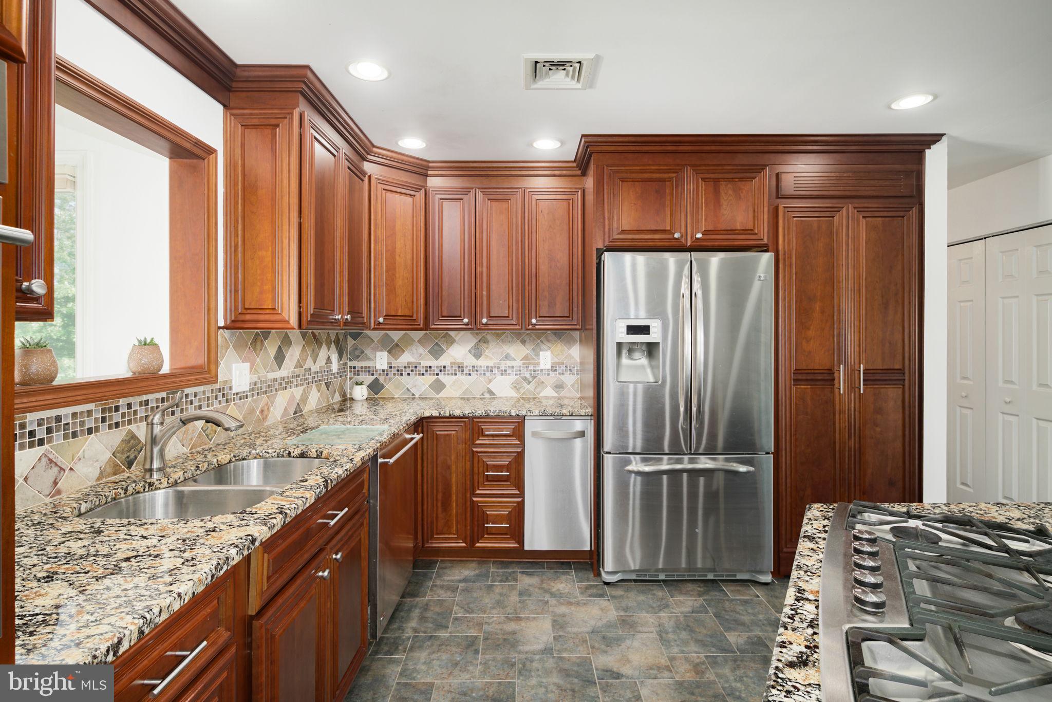 2041 Pennington Road Trenton, NJ 08618 - Photo 3 of 39 a kitchen with stainless steel appliances granite countertop a refrigerator and a sink