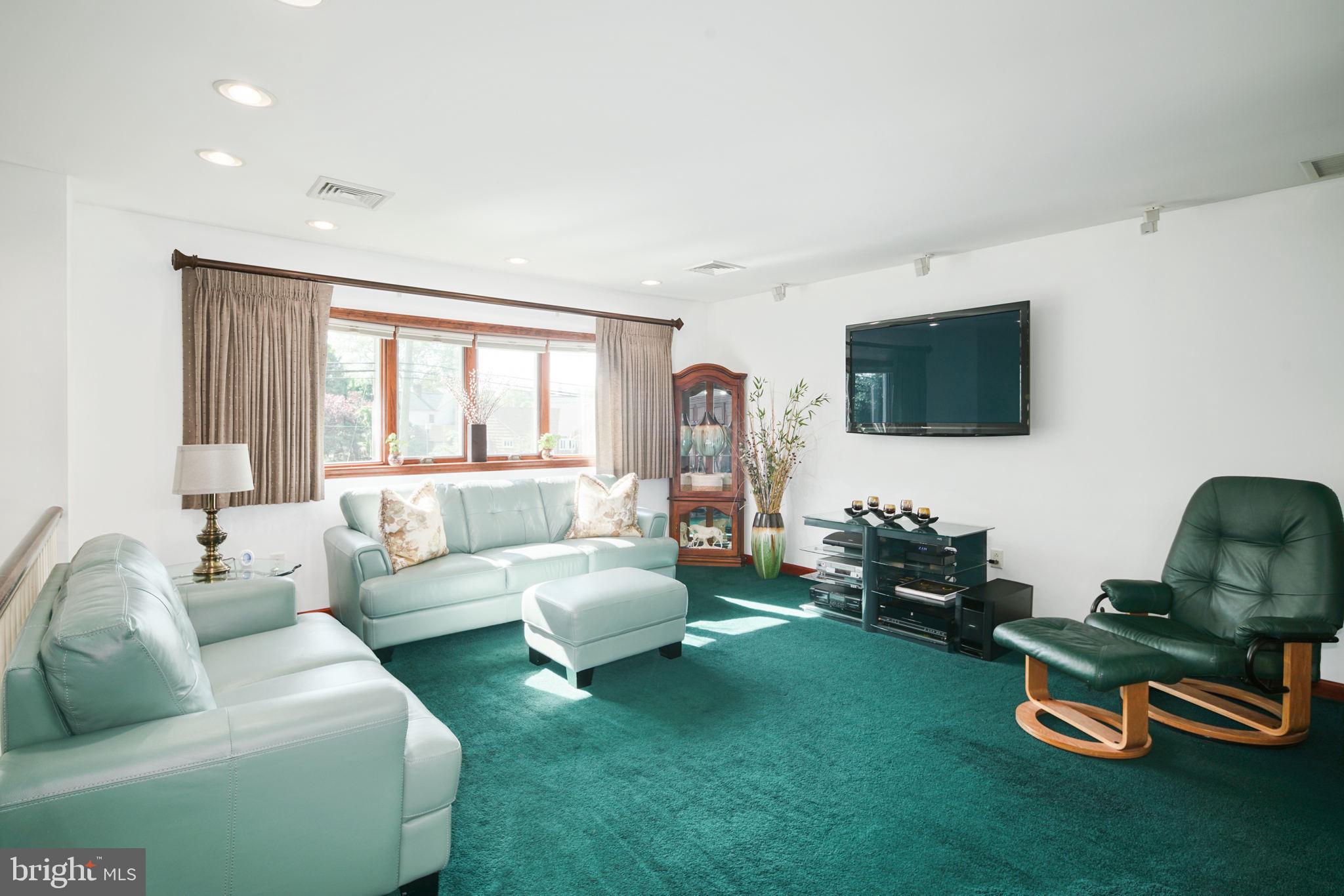 2041 Pennington Road Trenton, NJ 08618 - Photo 4 of 39 a living room with furniture and a flat screen tv