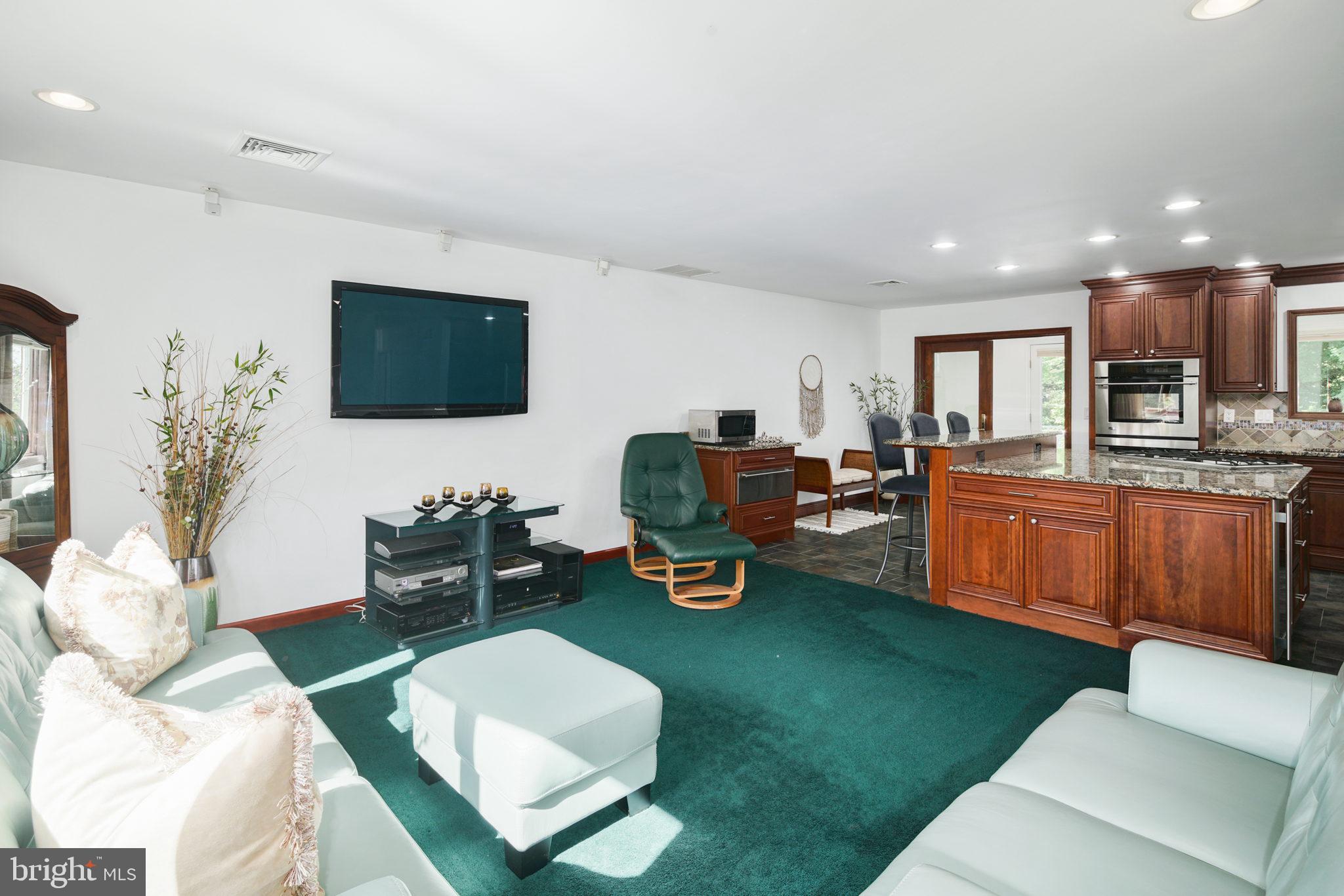 2041 Pennington Road Trenton, NJ 08618 - Photo 8 of 39 a living room with furniture a flat screen tv and a large window