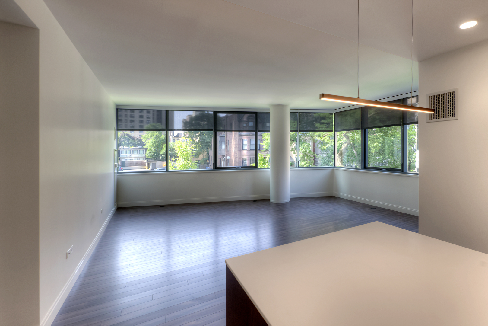 Undisclosed Address Chicago, IL 60657 - Photo 2 of 14 an empty room with windows