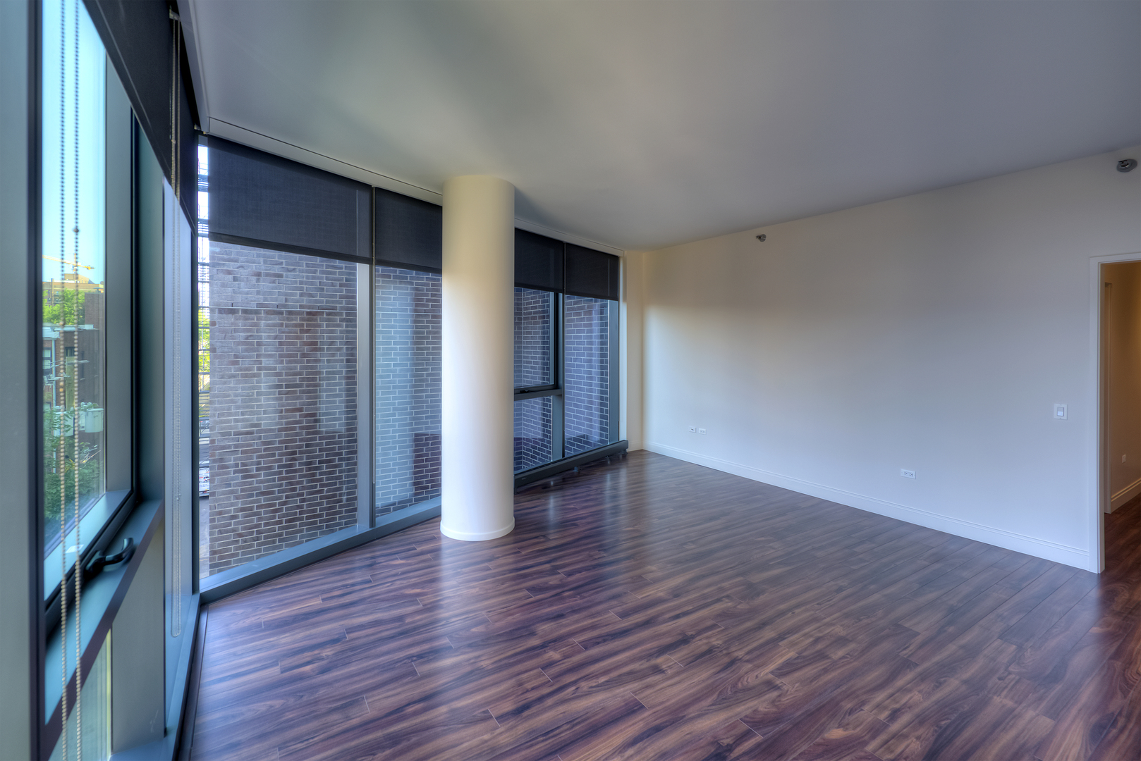 Undisclosed Address Chicago, IL 60657 - Photo 5 of 14 a view of an empty room with wooden floor and a window
