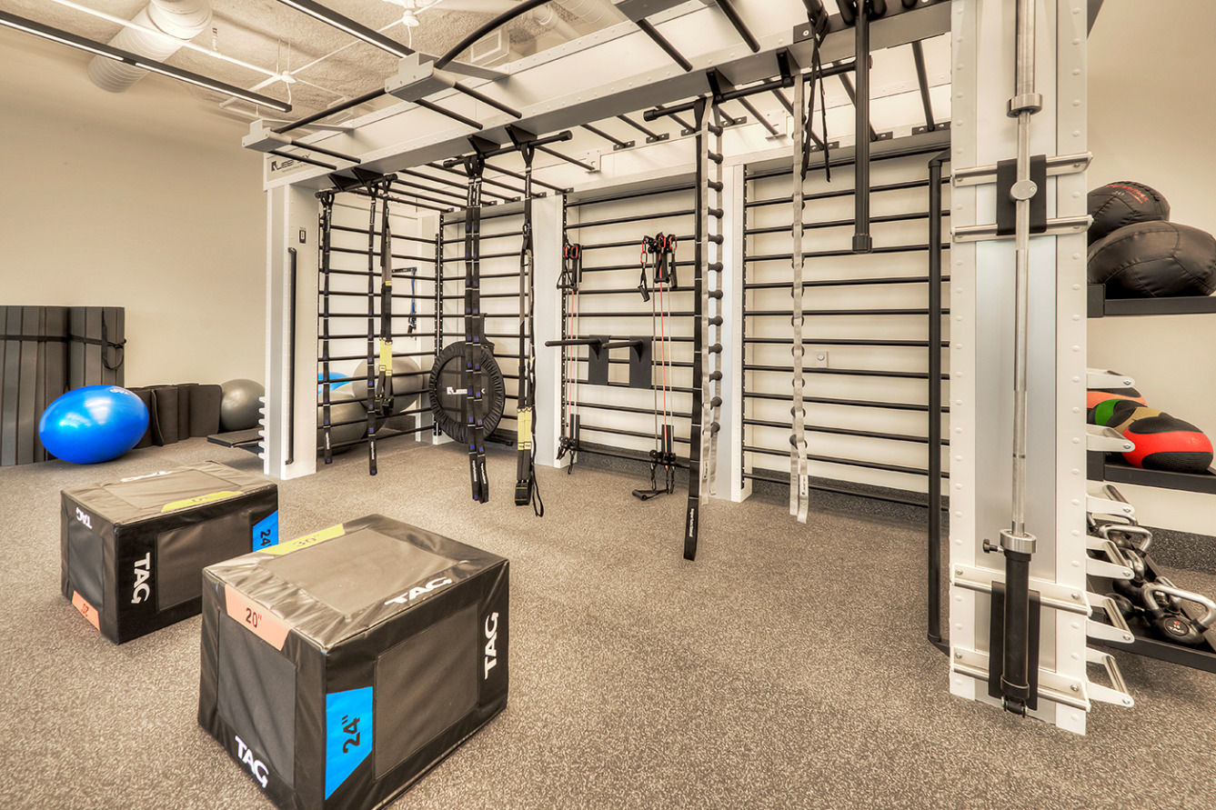 Undisclosed Address Chicago, IL 60657 - Photo 9 of 14 a room with furniture and gym equipment