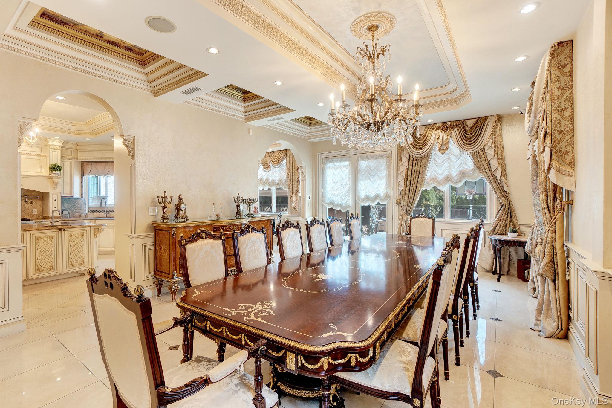 181-30 Tudor Road Queens, NY 11432 - Photo 15 of 46 Dining space featuring arched walkways, french doors, ornamental molding, light tile patterned floors, and recessed lighting