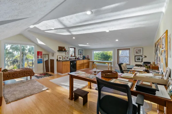 a group of people sitting in a living room
