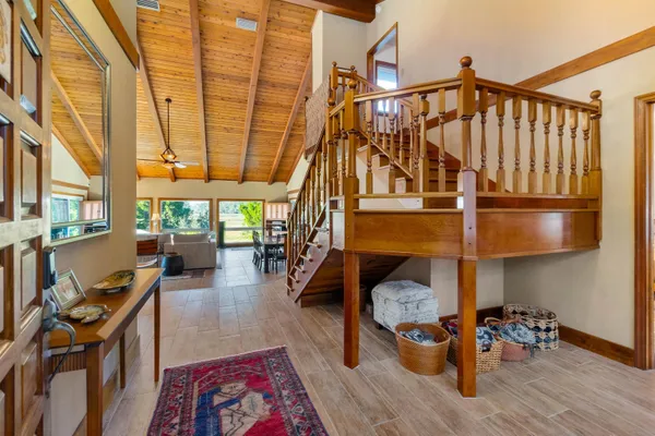 a bench sitting in middle of a park next to a yard