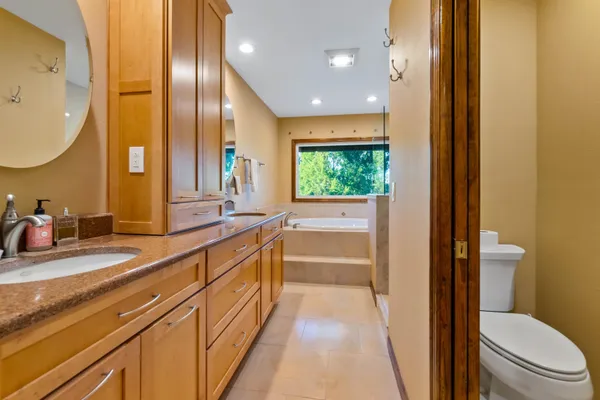 a bathroom with a sink a bathtub and a shower