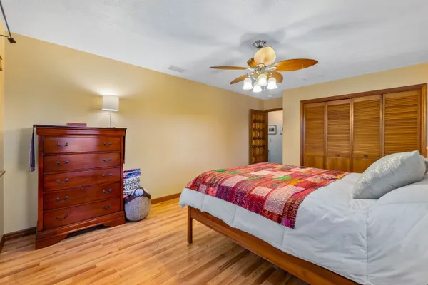 a view of a patio with chairs and potted plants