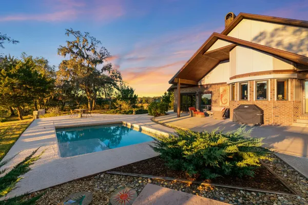 a view of a lake with houses in the back