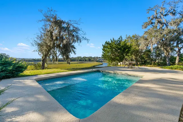 a view of a lake with houses in the back