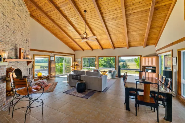 a view of a dining room with furniture window and outside view