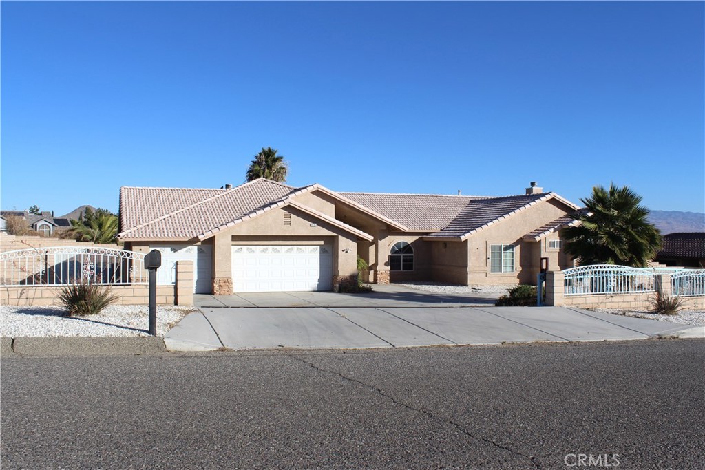 16263 Chiwi Road Apple Valley, CA 92307 - Photo 2 of 40 a view of a house with a street