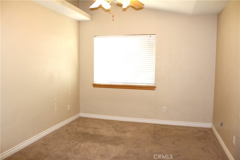 16263 Chiwi Road Apple Valley, CA 92307 - Photo 29 of 40 an empty room with a window