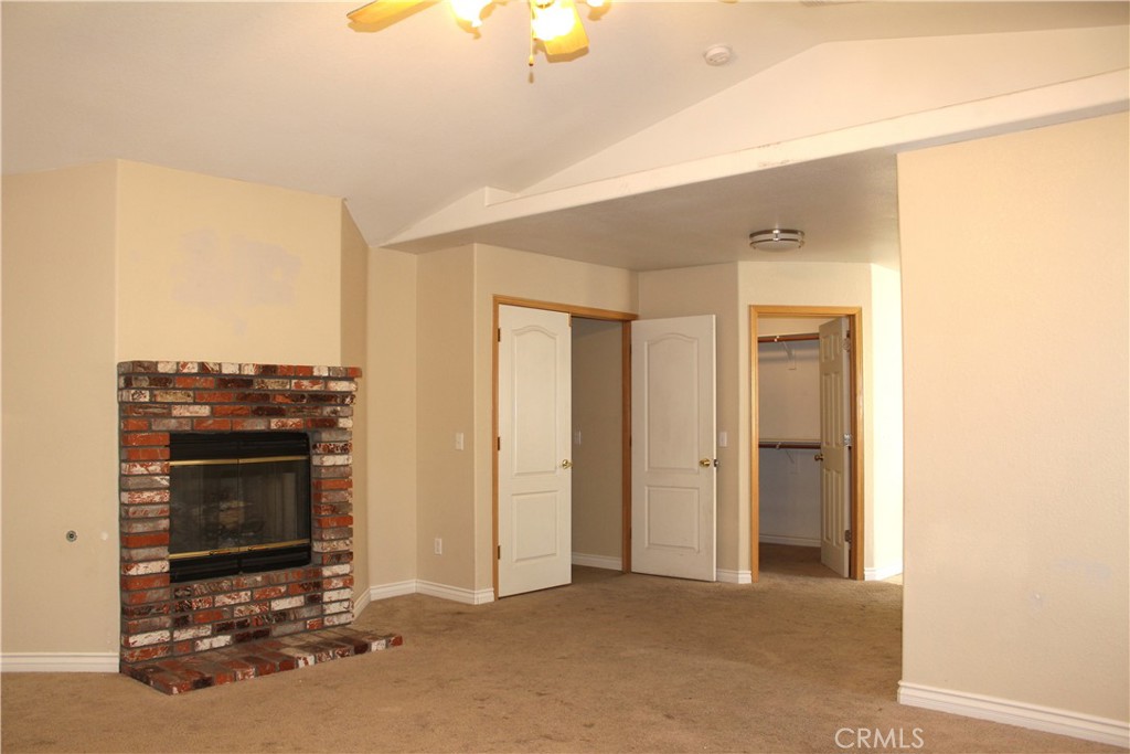 16263 Chiwi Road Apple Valley, CA 92307 - Photo 34 of 40 a view of a livingroom with a fireplace
