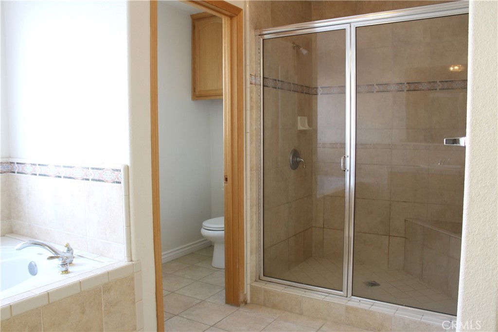 16263 Chiwi Road Apple Valley, CA 92307 - Photo 37 of 40 a bathroom with a shower and a sink