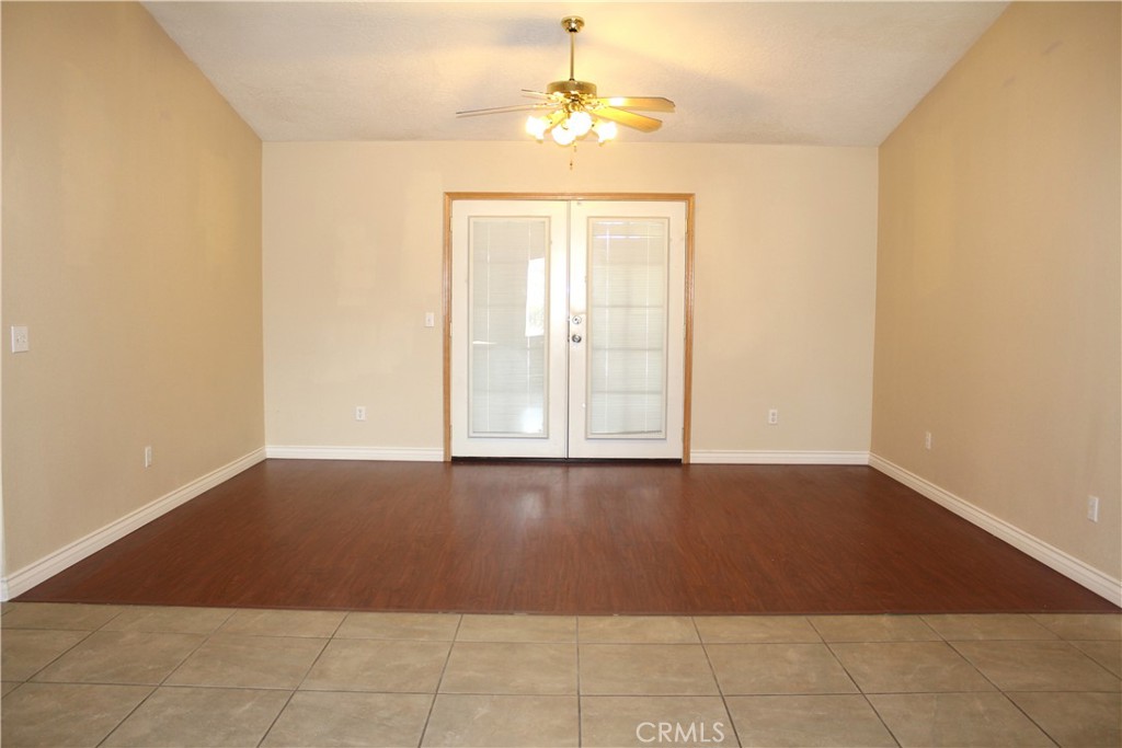 16263 Chiwi Road Apple Valley, CA 92307 - Photo 5 of 40 a view of an empty room with a window