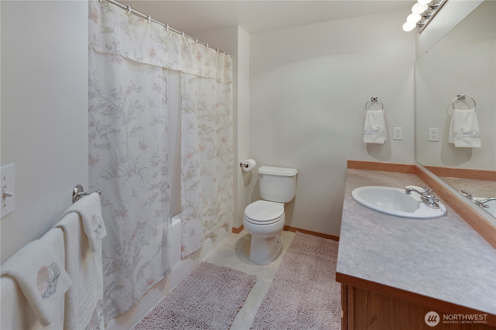 31 2nd Street Port Hadlock, WA 98339 - Photo 23 of 38 a bathroom with a granite countertop toilet and a sink