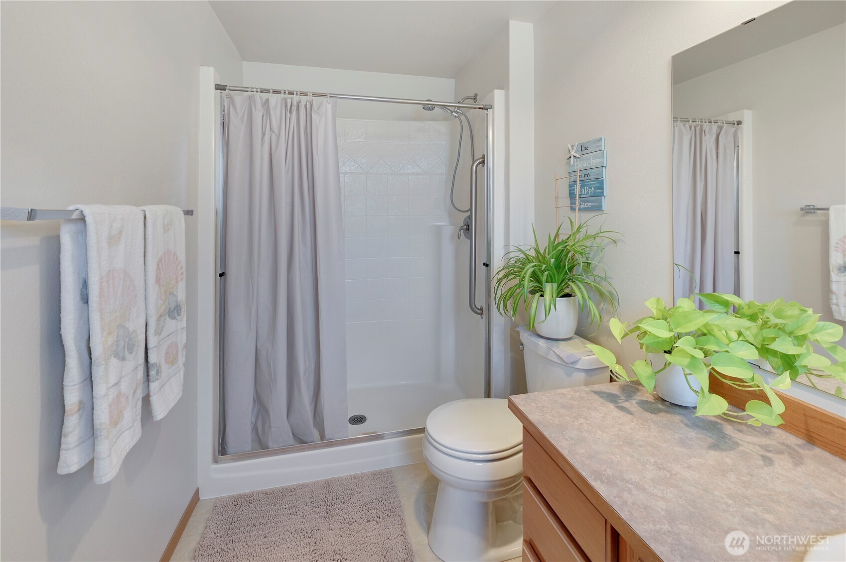 31 2nd Street Port Hadlock, WA 98339 - Photo 23 of 38 a white toilet sitting next to a shower curtain