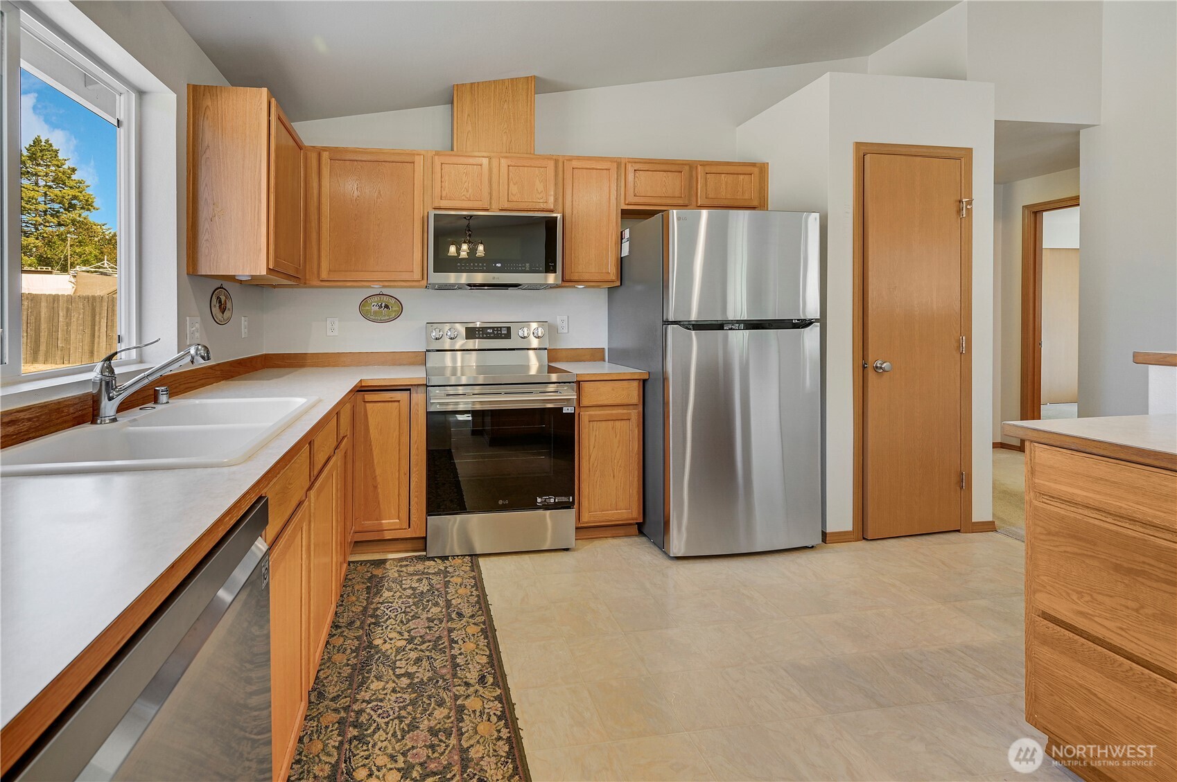 31 2nd Street Port Hadlock, WA 98339 - Photo 3 of 38 a kitchen with stainless steel appliances granite countertop a refrigerator stove and microwave