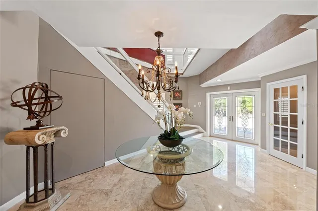 a living room with furniture fireplace and a large window