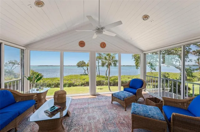 a large kitchen with a counter space a sink appliances and dining table