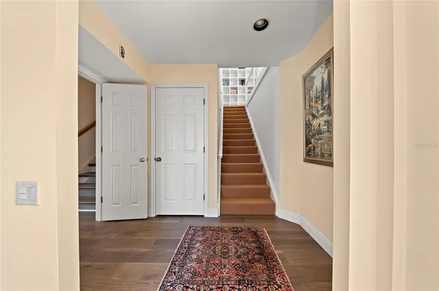 a living room with a couch and a rug