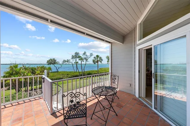 a view of swimming pool with outdoor seating and plants
