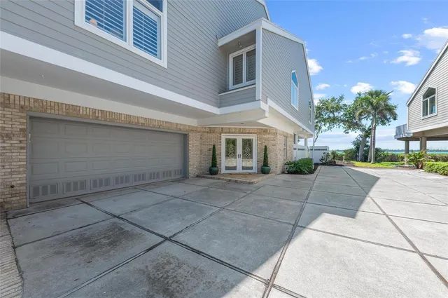 a living room with furniture a large window and a fireplace