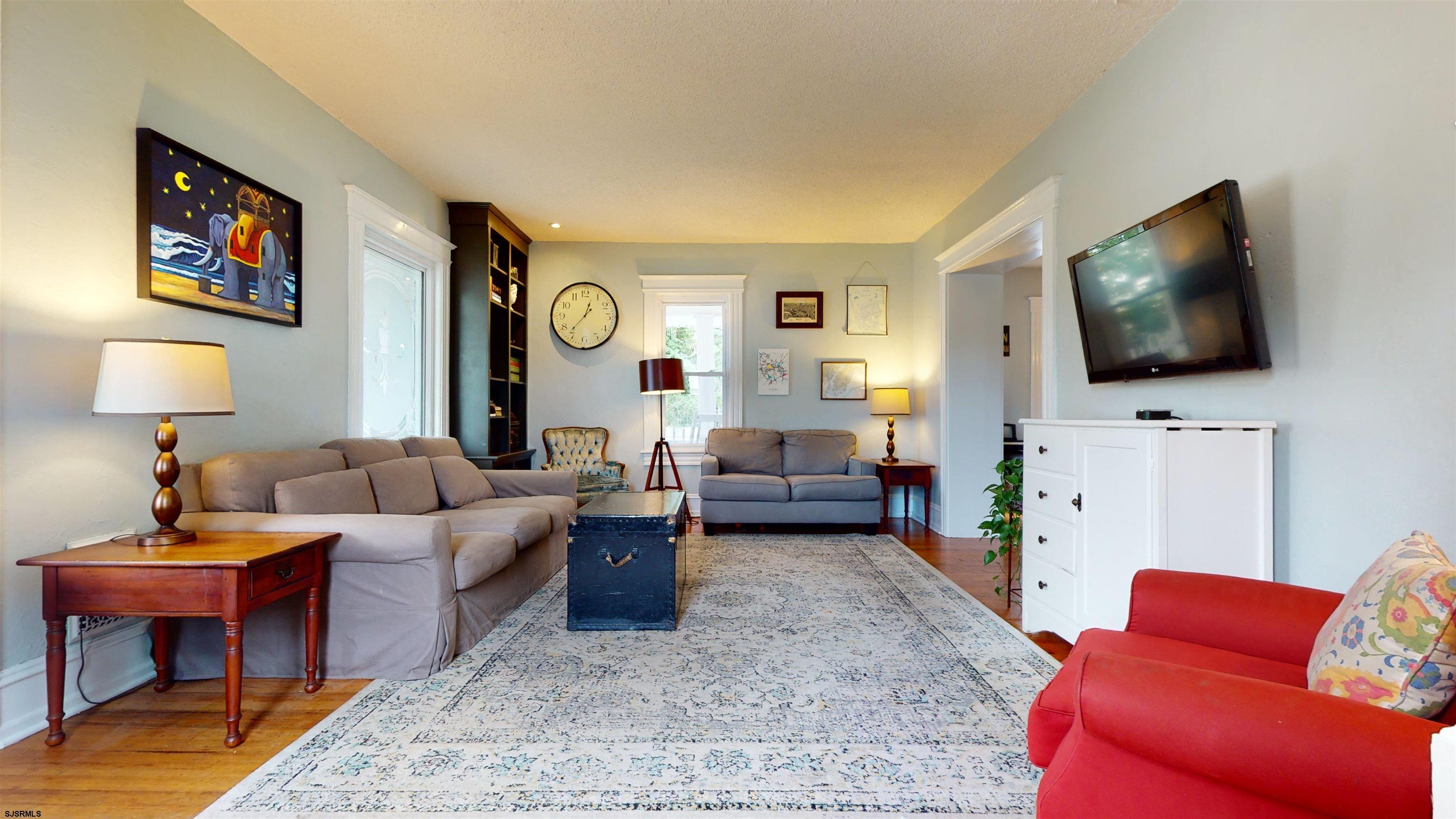 1409 Shore Road Northfield, NJ 08225 - Photo 12 of 50 a living room with furniture and a flat screen tv