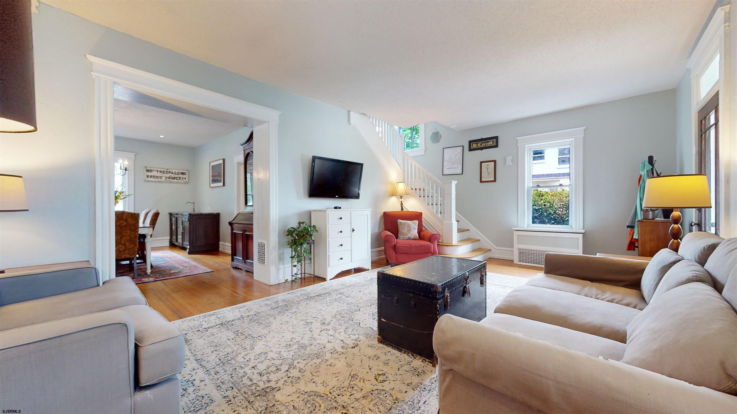 1409 Shore Road Northfield, NJ 08225 - Photo 13 of 50 a living room with furniture and a flat screen tv