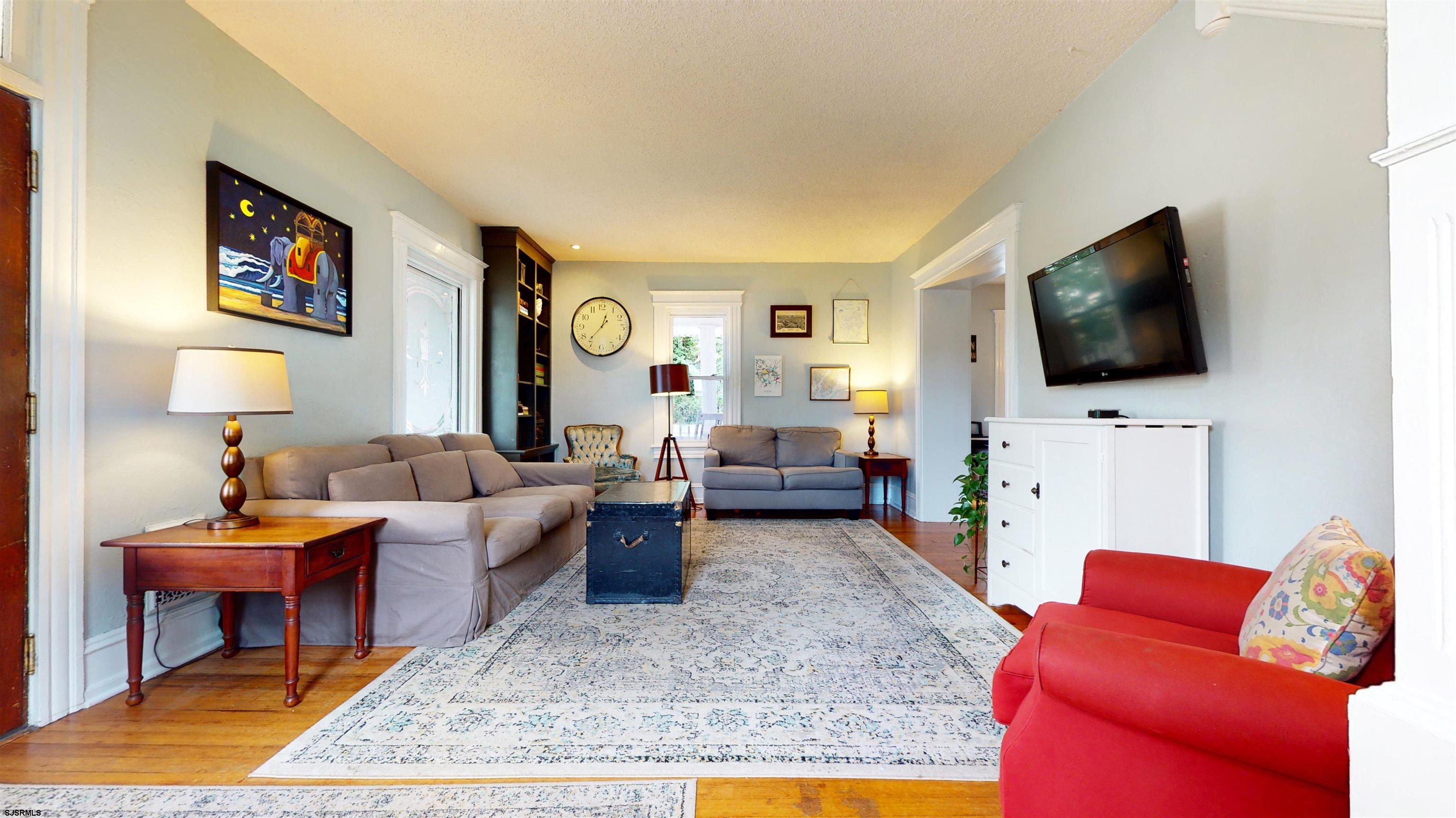 1409 Shore Road Northfield, NJ 08225 - Photo 14 of 50 a living room with furniture and a flat screen tv