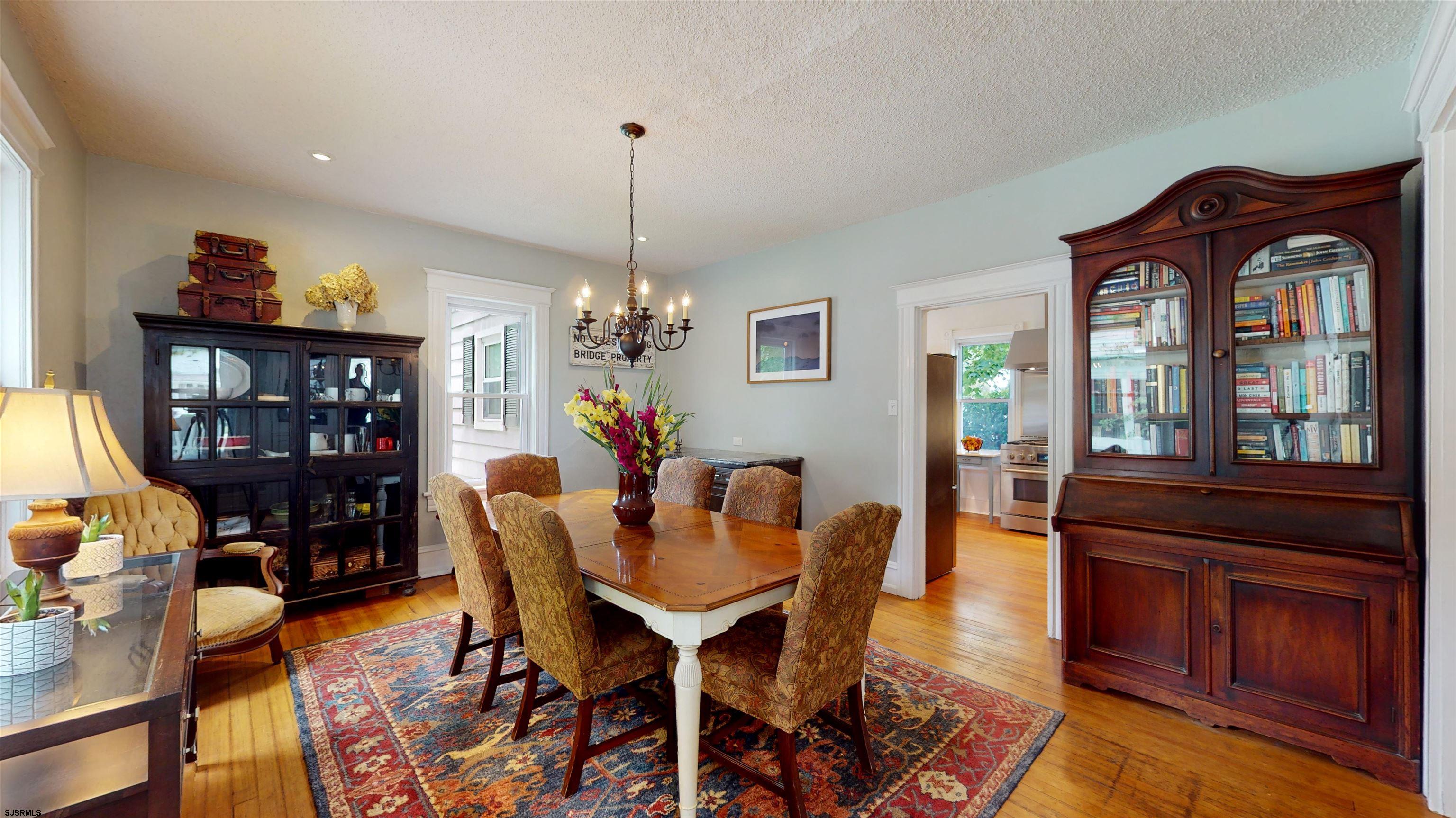 1409 Shore Road Northfield, NJ 08225 - Photo 15 of 50 a view of a dining room with furniture window and wooden floor