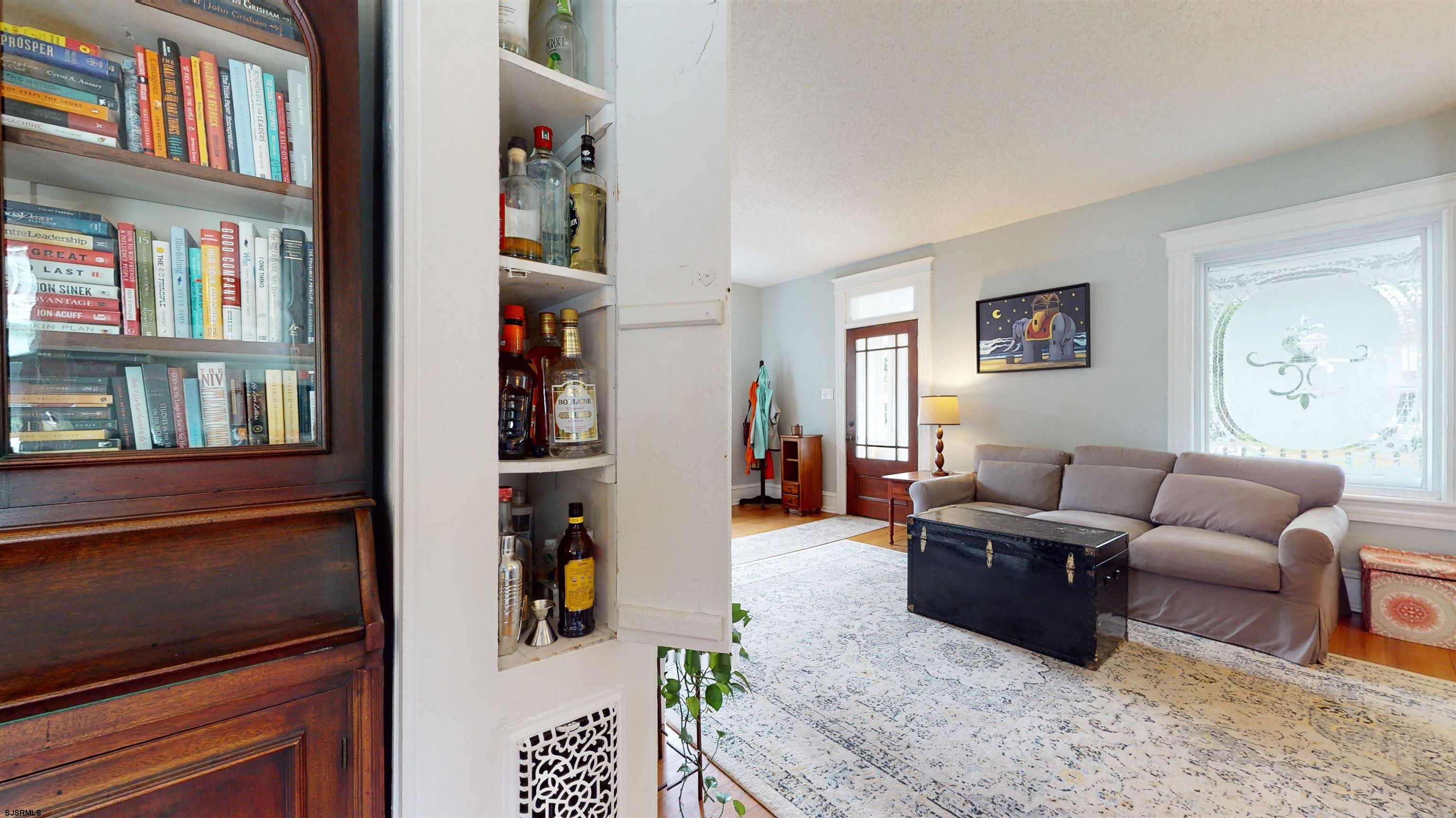 1409 Shore Road Northfield, NJ 08225 - Photo 17 of 50 a living room with furniture and painting on the wall