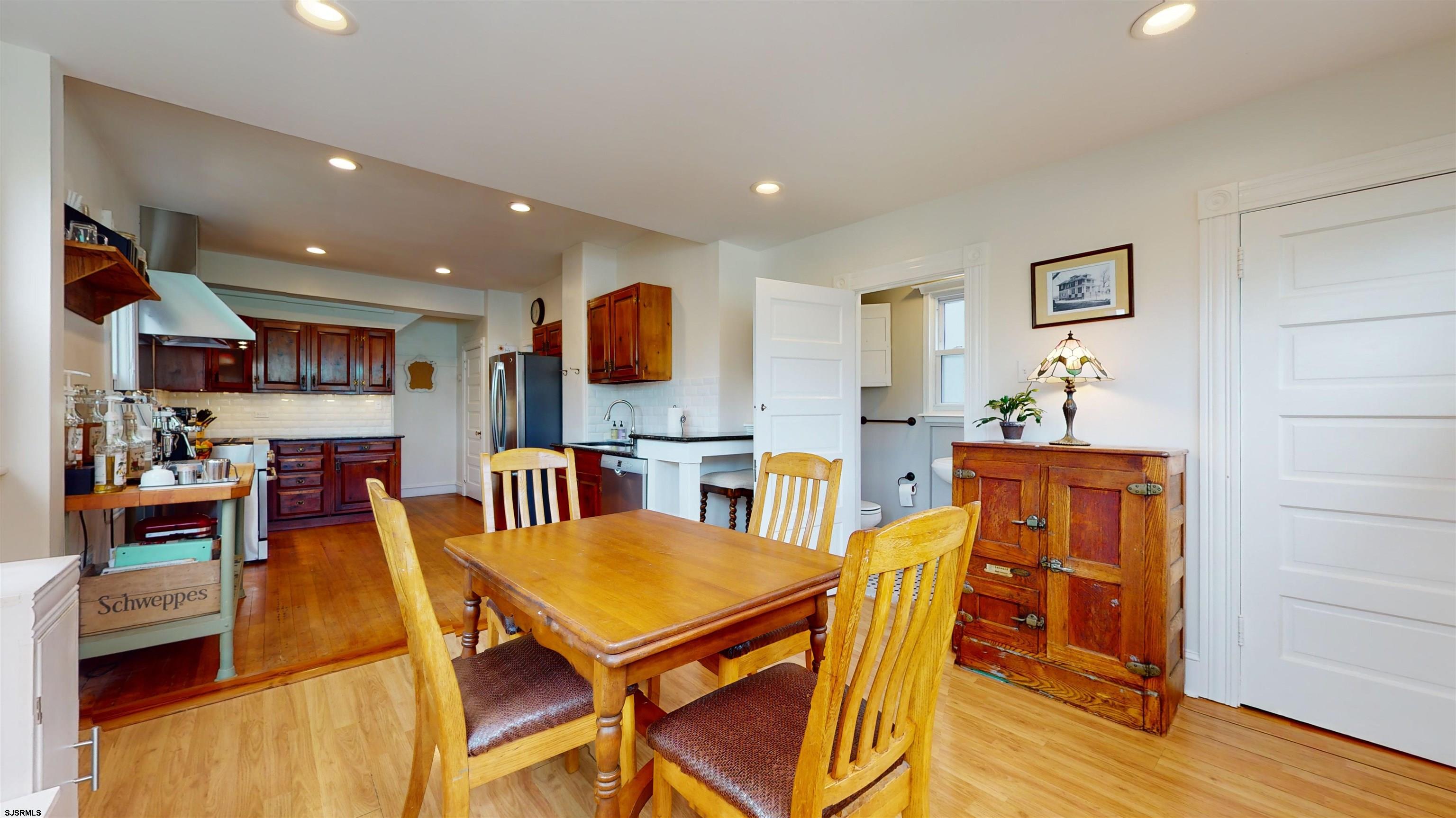 1409 Shore Road Northfield, NJ 08225 - Photo 20 of 50 a dining room with furniture and wooden floor