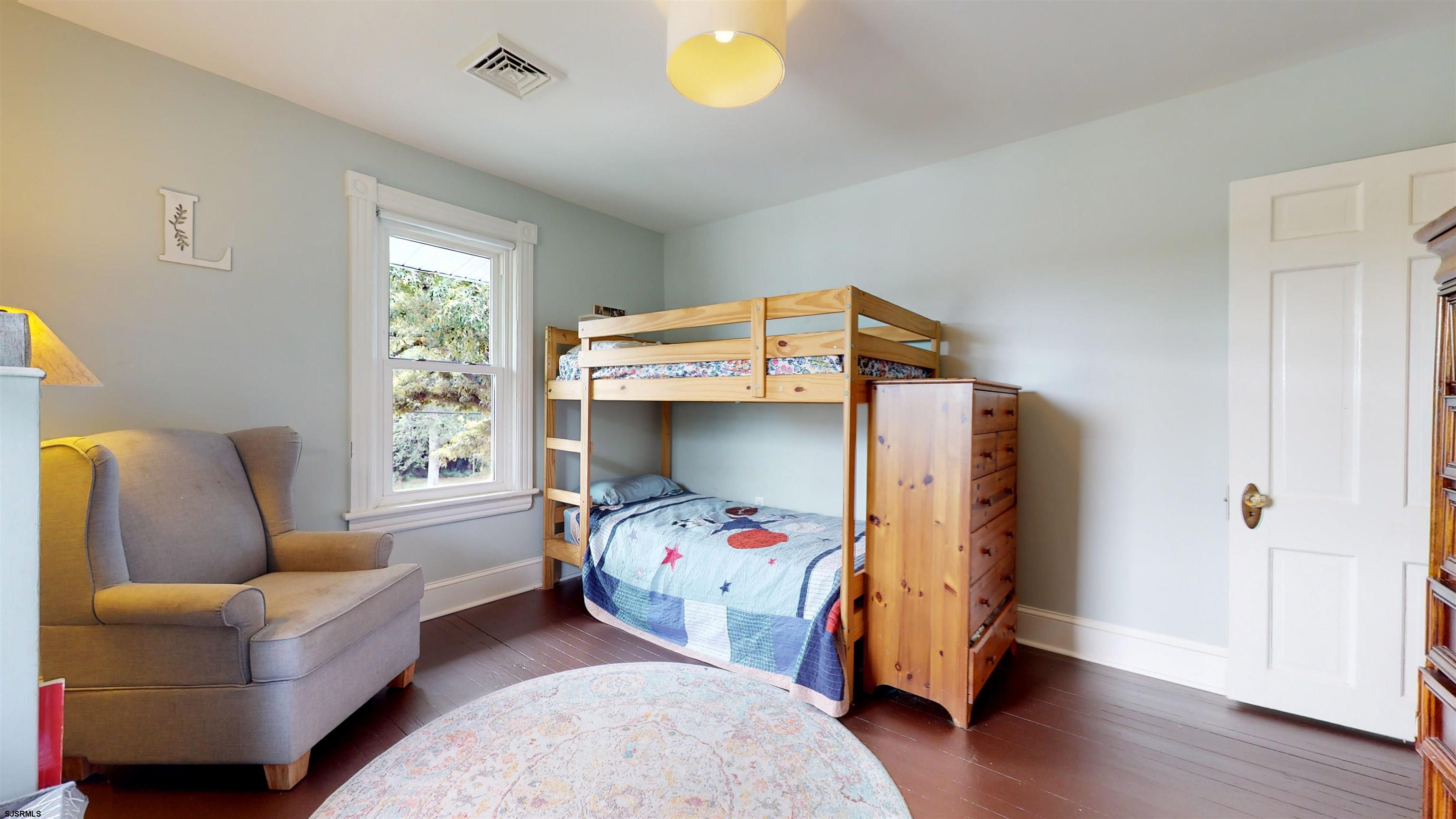 1409 Shore Road Northfield, NJ 08225 - Photo 30 of 50 a bedroom with bed and a window