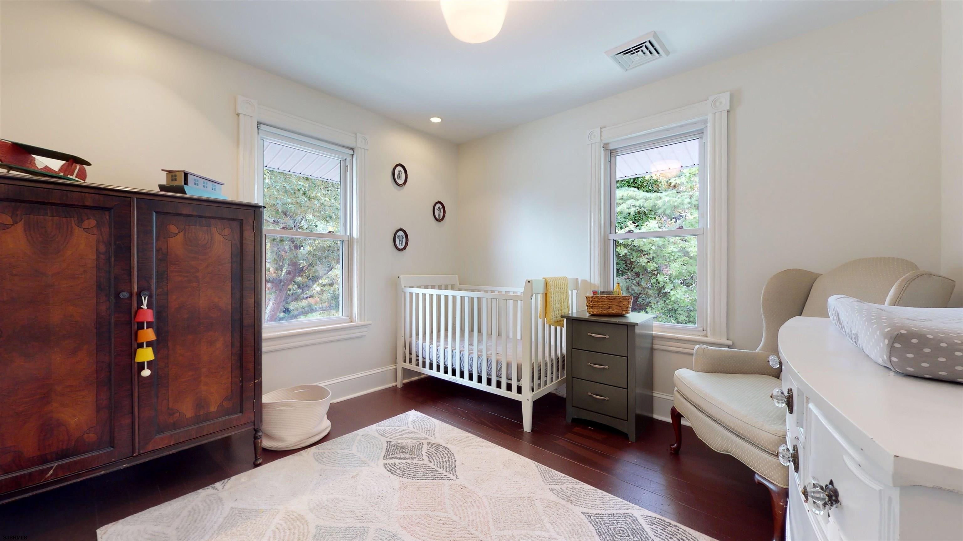 1409 Shore Road Northfield, NJ 08225 - Photo 31 of 50 a bedroom with furniture and a window